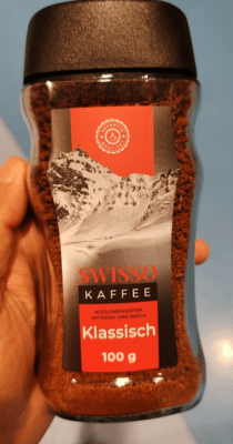 Regular sized glass coffee jar with red label