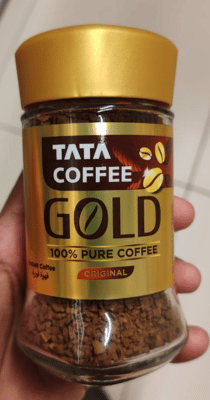 Small glass coffee jar with gold label